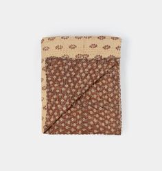 a brown and white floral print pocket square