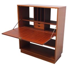 a wooden desk with drawers and shelves on it