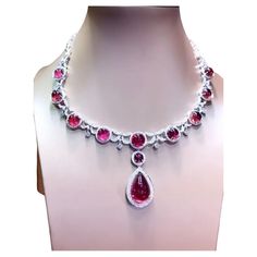 Splendid Rubellite Tourmalines and Diamonds necklace, extremely hard to collect a set of rubellite tourmaline like this. So perfect matched, too stunning, too satisfying . Wearing jewels can make a person feel confident, elegant and stylish. They can add sparkly and glamour to any outfit, and can be a way of expressing personal style and taste. Jewels can also hold sentimental value, often being passed down through generations, and can serve as reminders of precious memories and loved ones. Magnificent necklace come in 18k gold with 11 pieces of Natural Rubellite Tourmalines , in perfect Cabochon/oval/pear cut, spectacular color, fine quality, of 79,00 carats, and 495 pieces of Natural Diamonds, in round brilliant cut , of 5,80 carats, F color VS clarity, so sparkly. Handcrafted by artisan Kundan Jewellery Set, Diamonds Necklace, Rubellite Tourmaline, Expensive Jewelry, Make A Person, Ruby Jewelry, Precious Memories, Jewelry Design Necklace, Hand Jewelry