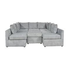 a large gray sectional couch with ottomans on the bottom and one foot in the middle