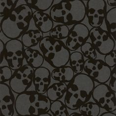 a bunch of skulls that are in the shape of a pattern on a black background