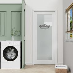 a washer and dryer in a room with green walls