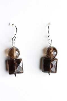 Smoky Quartz Brown 10mm Square and 8mm Ball Faceted Natural Gemstone Earrings with .925 Sterling Silver Hooks and pins Measures 1 1/4" long ***Rubber Ear Wire Stoppers INCLUDED with each pair of earrings*** Item ships via USPS immediately upon receipt of payment Jewels By Jackie founded in 2009 by Jewelry designer Jacqueline Krohmer. Her jewelry is hand crafted, handmade, and sourced responsibly. She takes great care with her customers and welcomes any custom requests for handmade jewelry designs. Most of her art is in .925 Sterling Silver as her preferred metal to work with. We also have copper, silver, brass, and some gold in our inventory. We have over 90 gemstone selections. Shop our Ebay Store JewelsbyJackiecom for new listings daily. All orders ship via USPS package service immediate Artisan Jewelry Earrings, Handcrafted Artisan Jewelry, Handmade Jewelry Designs, Copper Rings, Jewelry Designer, Faceted Gemstones, 925 Sterling Silver Earrings, Smoky Quartz, Ear Wire