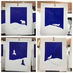 four pictures of blue and white paper with animals in the snow at night, on clothes pins