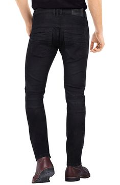 Moto stitching and tonal distressing adds an edgier look to skinny-fit jeans with a tapered leg for comfort in your day-off wardrobe. 13" leg opening; 9 3/4" front rise Zip fly with button closure 98% cotton, 2% elastane Machine wash, tumble dry Imported Model stats: 6'1" height, 32" waist. Fitted Distressed Black Jeans, Fitted Black Distressed Jeans, Black Washed Fitted Jeans, Fitted Ripped Washed Black Jeans, Fitted Washed Black Ripped Jeans, Rugged Fitted Distressed Jeans, Rugged Distressed Fitted Bottoms, Rugged Fitted Distressed Bottoms, Edgy Look