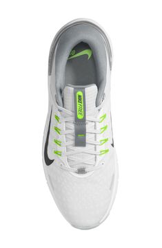 the nike air zoom low is white and grey with neon green accents on the upper part