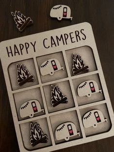 the happy campers magnets are arranged in an open box on top of a table