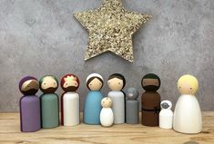 a group of wooden dolls standing in front of a star