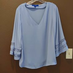 Lightweight Periwinkle Flutter Sleeve Top. Washed But Never Worn. Elegant Flowy Blue Tops, Blue Flutter Sleeve Blouse For Work, Blue Flutter Sleeve Blouse For Spring, Blue Flutter Sleeve Blouse For Brunch, Flutter Sleeve Blue Blouse For Brunch, Spring Blue Blouse With Butterfly Sleeves, Spring Blue Butterfly Sleeve Blouse, Flutter Sleeve Blouse, Flutter Sleeve Top