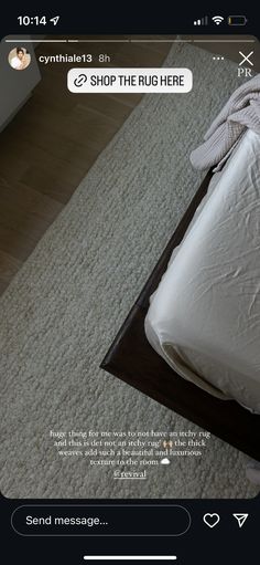 a bed with white sheets on top of it and a pillow in the bottom right corner