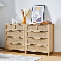 an image of a dresser with drawers in the living room or dining room area that is clean and ready for guests to use