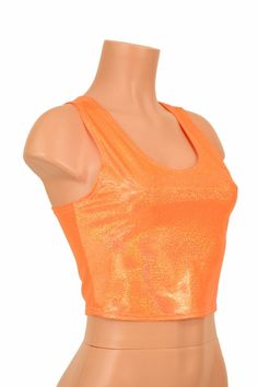 "This item is made to order, please read all the way through the listing before purchasing! This sizzling hot orange holographic crop top has an amazing rainbow shine! It features a scoop neckline in front and an edgy racerback design in the back. It is made of four way stretch lycra spandex, and it fits like a glove! Super figure flaunting and fun! This top is just perfect when paired with any of our bike shorts or high waist leggings for a sporty look. LENGTH: 8\" (from the underarm to the hem Holographic Crop Top, Rave Festival, Sporty Look, Bike Shorts, High Waisted Leggings, Scoop Neckline, One Shoulder Blouse, Athletic Tank Tops, Sleeveless Top