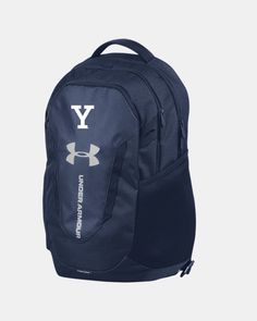 the under armour backpack is blue and has white letters that read y, on it