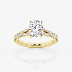 a yellow gold engagement ring with diamonds on the band and a round cut diamond in the center