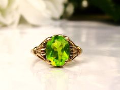 Art Deco Oval Cut 1.86ct Green Glass Ring by LadyRoseVintageJewel Oval Green Gemstone Birthstone Ring, Green Oval Birthstone Ring For Anniversary, Formal Green Oval Birthstone Ring, Lime Green Oval Jewelry For May Birthstone, Classic Lime Green Oval Jewelry, Green Cabochon Art Deco Rings, Retro Green Oval Jewelry, Antique Green Oval Jewelry, Oval Peridot Green Jewelry