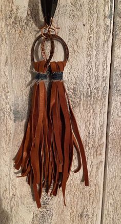 Tan Deerskin Leather Denim Copper Metal Copper Earwires 7 inches Brown Tassel Earrings For Festivals, Brown Fringe Tassel Earrings For Festivals, Adjustable Brown Bohemian Tassel Earrings, Bohemian Brown Fringe Earrings, Bohemian Brown Beaded Tassel Earrings, Brown Tassel Jewelry For Festivals, Adjustable Fringe Tassel Dangle Earrings, Brown Fringe Tassel Dangle Earrings, Brown Fringe Dangle Tassel Earrings