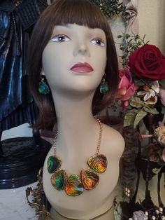 "A beautiful dichroic faceted glass necklace with five large teardrop 1 3/4\" long and 1 1/2\" at widest angle. All dichroic teardrops are gold encased. The lenght of this stunning necklace is 17\" with a two inch extension. The dichroic glass is bronze, green, yellow in color. Colors looks different in lighting. The earrings measure 1\" long and 1 1/4\" wide. All pieces are in beautiful condition. Wow! This set is a stunner. A great look for any occasion." Gold Teardrop Czech Glass Jewelry, Unique Czech Glass Teardrop Jewelry, Multicolor Faceted Teardrop Jewelry, Teardrop Czech Glass Jewelry For Parties, Czech Glass Teardrop Jewelry For Parties, Party Teardrop Czech Glass Jewelry, Party Czech Glass Teardrop Jewelry, Creative Necklace, Black Onyx Necklace