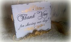 a white and gold sign that says thank you for sharing our day with someone else