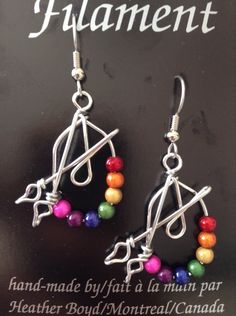 These earrings are a great gift for artists and art teachers. Beads are called Miracle Beads. Wire is non-tarnish aluminum. Surgical steel earring hooks are hypo-allergenic. I have been making custom wire art and jewelry for 30 years. I started in 1989 selling jewelry on the streets of Montreal. Over the years I have participated in many craft shows, exhibitions and sold my work in gallery shops across Canada including the National Gallery of Canada. My husband and I specialize in custom wedding Artsy Wire Wrapped Earrings Gift, Adjustable Artsy Nickel-free Hoop Earrings, Artsy Adjustable Hypoallergenic Jewelry, Artsy Adjustable Nickel-free Beaded Earrings, Adjustable Nickel-free Beaded Artsy Earrings, Adjustable Nickel-free Artsy Beaded Earrings, Adjustable Beaded Earrings For Gifts, Artsy Nickel-free Dangle Hoop Earrings, Artsy Nickel-free Hoop Earrings As Gift