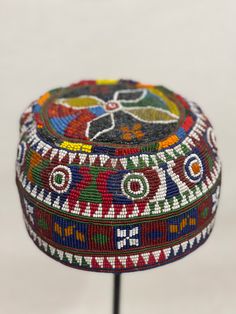 A rare example to this group of beaded hats from Afghanistan. Traditional Ceremonial Hats With Short Brim, Multicolor Bohemian Hat With Bead Caps, Multicolor Bead Caps Hats For Festival, Multicolor Bead Cap Hats For Festivals, Multicolor Beaded Short Brim Hat, Multicolor Beaded Hat With Curved Brim, Multicolor Festival Hats With Bead Caps, Multicolor Bead Caps Festival Hats, Traditional Beaded Hats For Festivals