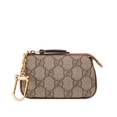 Gucci Gg Supreme Monogram Key Case Coin Purse Key Cles This Is An Authentic Gucci Gg Supreme Monogram Key Case In Brown. This Stylish Key Case Is Crafted Of Gucci Gg Monogram Coated Canvas With An All Around Dark Brown Leather Trim. The Case Unzips With An Overextended Zipper To A Brown Interior Featuring A Gold D-Ring Zipper Pull To Attach To Any Handbag. Gucci Coin Pouch Beige And Ebony Gg Supreme Canvas Brown Leather Trim Gold-Toned Hardware Internal Keychain Hook Zip Closure 4.75"W X 3"H X 0 Gucci Key Pouch, Luxury Brown Gucci Wallet, Designer Gucci Wallets With Gold-tone Hardware, Luxury Formal Bags With Logo Charm, Classic Gucci Wallet With Gold-tone Hardware, Classic Gucci Wallets With Gold-tone Hardware, Luxury Wallets With Gold-tone Hardware As Gift, Keychain Hook, Key Pouch