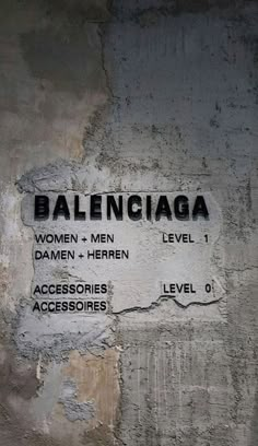 a sign on the side of a building that says baleinicaga women + men level 1