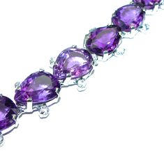 Handmade Unique 925 Sterling Silver bracelet with unique one of a kind Amethyst,  22.30 grams of marvelous handcrafted jewelry design. Only one piece availble ready to ship! It's unique worldwide bracelet - simply piece of art in world of fine jewelry. Authentic  faceted Amethyst  .925   Sterling Silver handcrafted Bracelet  BRACELET DETAILS: Weight: 22.30g; Material: Sterling Silver; Main stone: Amethyst; Other stones: White Topaz; Width (widest section): 1/2 inch; Inner circumference: 7  inch; Fine Amethyst Jewelry, Amethyst Bracelet In Fine Jewelry Style, Purple Fine Jewelry Bracelet, Amethyst Bracelet Fine Jewelry, Fine Jewelry Amethyst Bracelets Gift, Formal Amethyst Gemstone Sterling Silver Bracelet, Sterling Silver Amethyst Gemstone Bracelet For Anniversary, Elegant Sterling Silver Amethyst Gemstone Bracelet, Amethyst Gemstone Bracelet Jewelry