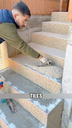 a man that is standing on some steps with his foot in the cement and looking at something