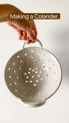 a person is holding a colander in their hand and the words making a colander above it