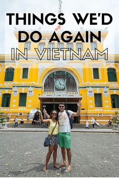 two people standing in front of a yellow building with the words things we do again in vietnam