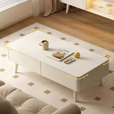 a white coffee table sitting on top of a living room floor next to a couch