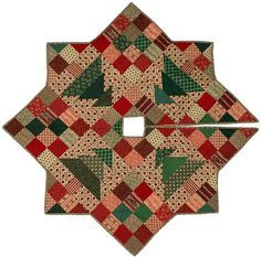 a patchwork christmas tree ornament is shown in red, green and beige