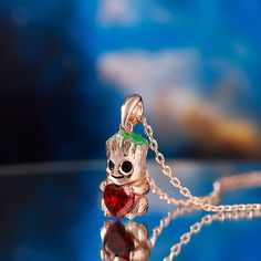 Each cartoon tree style necklace is made of sterling silver and inlaid with red heart stones, the design is very cute and super adorable. If you or someone you love is a baby tree at heart, each necklace is a must-have piece in your jewelry collection! The tree baby is so cute, smart and all of us love his brave. If you want him to be always by your side, put on this necklace immediately. You will find more adorable and creative designs in our Hug Me® collection.Carat Weight: 0.094 ctStone Size: Valentine's Day Themed Heart Jewelry, Valentine's Day Heart Shaped Themed Jewelry, Valentine's Day Heart-shaped Themed Jewelry, Whimsical Red Jewelry For Valentine's Day, Red Themed Jewelry For Valentine's Day, Red Valentine's Day Themed Jewelry, Themed Heart-shaped Jewelry Gift, Red Themed Necklace For Gift, Themed Red Necklace For Gifts