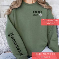 a female mannequin wearing a soccer mom sweatshirt with the words customize and mom on it