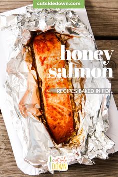 honey salmon in foil on a wooden table with text overlay that reads, honey salmon recipes baked in foil