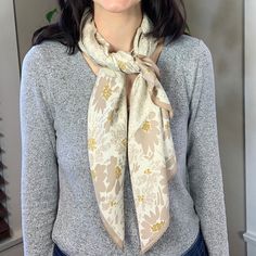 This Silky Bandana Scarf features Soft beige flowers and speckles on a warm light beige background. The options are endless with this Avenue Zoe Floral Speckled Printed Silky Bandana Scarf in Beige! It can be used as a bandana scarf, a beautiful hair wrap, tied as a top or to a handbag for extra flare. The 100% polyester material makes this bandana silky smooth, comfortable to wear as a headwrap or around the neck.Features:Style: Bandana, Hair WrapMaterial: 100% PolyesterColor/Pattern: Beige Flo Cream Floral Print Scarves For Spring, Beige Floral Print Scarves For Spring, Beige Floral Print Scarf For Spring, Bohemian Beige Scarves For Spring, Bohemian Beige Scarf For Spring, Light Beige Background, Style Bandana, Beige Flowers, Bandana Hair