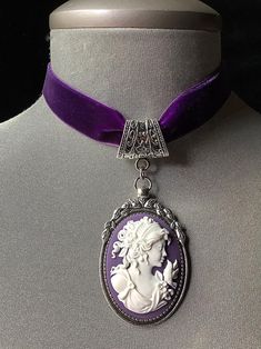 Purple cameo vintage cameo choker purple velvet choker | Etsy Vintage Purple Choker Necklace, Silver Gothic Cameo Jewelry, Vintage Cameo Choker Necklace, Elegant Purple Locket Jewelry, Victorian Cameo Silver Necklace, Victorian Cameo Jewelry In Antique Silver, Victorian Silver Cameo Jewelry, Vintage Purple Cabochon Jewelry, Elegant Purple Wedding Choker