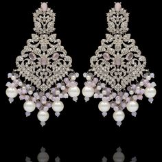 Remarkable heritage jewelry that portrays immaculate precision and technique! Exquisitely crafted earrings with pink and CZ stones along with pink moti and pearl adornments. Approximate earrings length is 4". Silver-plated on high-quality brass as base metal. Made by order. Kindly allow 5-7 weeks for the delivery of this item. For custom or urgent requests, please contact support@alacouture.com. *Please Note: We use faux stones and beads in all of our jewelry. Luxury Victorian Chandelier Earrings, Luxury Ornate Pierced Chandelier Earrings, Glamorous Pink Rhinestone Crystal Earrings, Pink Crystal Chandelier Earrings, Elegant Nickel-free Pink Chandelier Earrings, Unique Gift Cards, Heritage Jewellery, Create Words, Faux Stone