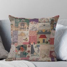 an old patchwork pillow on a couch