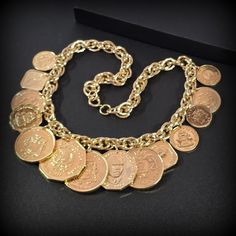 Designer Vintage Coin Necklace, Uncirculated The Golden Caribbean Dangling Coins Charm Coin Necklaces and earrings jewelry set Metal - 24KT Yellow Gold Plated  Stone - Size - short stand 17'' with clasp Mark - Franklin Mint  Circa the 1980s Condition - vintage good condition. PLEASE NOTE: Vintage jewelry can show signs of wear and discoloration or chipped metal consistent with age. Please look at the pictures carefully. Most were purchased at estate sales, auctions, etc. so they could need cleaning. If you need additional pictures or have questions, please contact me prior to purchase. I am not a jeweler or an expert. I do the best I can to research and represent the items. Also on auction purchases, I use the information I get from the auction houses. If you have any questions or need add Gold-tone Metal Jewelry Collectible, Gold-tone Metal Jewelry For Collectors, Gold-tone Coin Shaped Metal Jewelry, Collectible Metal Jewelry With Coin Pendant, Yellow Gold Medallion Temple Jewelry, Traditional Coin Pendant Jewelry For Formal Occasions, Traditional Coin Pendant Jewelry For Formal Events, Collectible Round Costume Jewelry, Gold Temple Jewelry With Coin Pendant