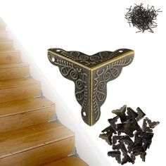 there are several pieces of wood on the stairs and next to it is a pile of nails