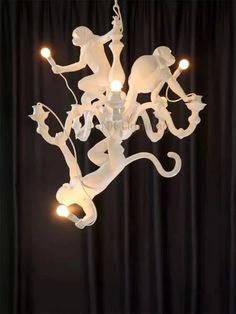 a white chandelier hanging from the ceiling