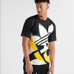 Go Big Or Go Home. This T-Shirt Features An Oversize Graphic With A Hand-Drawn Vibe. It's Made Of Soft Cotton Jersey Fabric With A Relaxed Fit Adidas Urban T-shirt With Graphic Print, Adidas Urban Tops With Graphic Print, Urban Adidas Tops With Graphic Print, Adidas Urban Short Sleeve Tops, Black Adidas Shirt For Streetwear, Adidas Black Shirt For Streetwear, Urban Black Adidas Tops, Adidas Yellow Sporty Top, Yellow Adidas Sporty Top