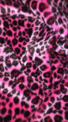 an animal print fabric with pink and black spots on the top, as seen from above