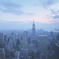 an aerial view of new york city at dusk