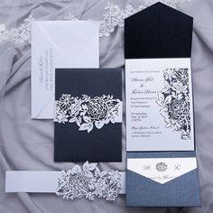 the black and white wedding stationery is on display