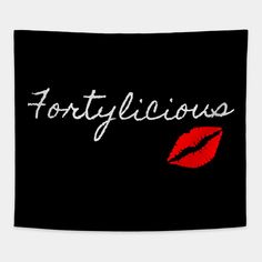 the word fortlylicious written in white on a black background with red lipstick