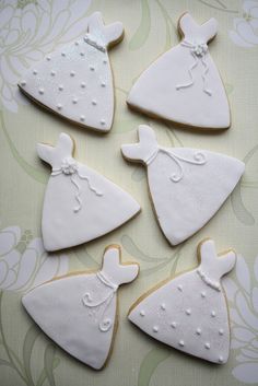 six decorated cookies in the shape of christmas trees