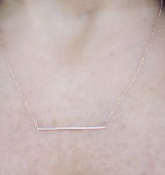 "This dainty 14k gold diamond bar necklace is cute and sparkles beautifully. The bar is about 1 1/4\" long. I've added loops at the end of the necklace so you can wear it anywhere from 16\"-18\" which makes it great for layering! Makes for a great gift or just for yourself! *Diamond weight 0.07cts *Solid 14k gold Upgrades for FedEx/UPS guaranteed 2-day delivery are available and can be selected prior to checkout without separate invoicing. It is generally not an issue, but the USPS cannot guaran Diamond Bar Necklace Fine Jewelry Gift, Fine Jewelry Diamond Bar Necklace As Gift, Diamond Bar Necklace Gift Fine Jewelry, Fine Jewelry Diamond Bar Necklace Gift, Minimalist Diamond Accents Bar Necklace As Gift, Minimalist Diamond Accents Bar Necklace Gift, Minimalist Bar Necklace With Diamond Accents, Minimalist Bar Necklace With Diamond Accents As Gift, Minimalist Bar Necklace With Diamond Accents For Gift