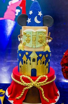 a mickey mouse birthday cake with red, white and blue decorations